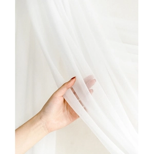 White sheer chiffon wedding arch drapery with wrinkle-free semi-transparent texture