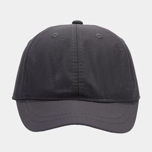 Detail of dark gray quick-dry baseball cap featuring six-panel construction and eyelets