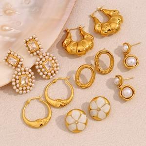 18K gold plated earring set featuring hollow flowers, pearls, and zircon crystals