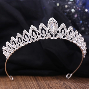 Elegant bridal tiara with leaf design and teardrop rhinestone on sparkling background