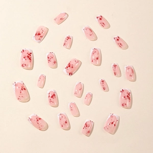 Square Halloween false nails with white French tips and red blood splatter patterns