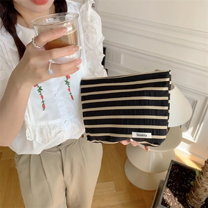 Large striped fabric cosmetic bag with zipper for travel and skincare storage