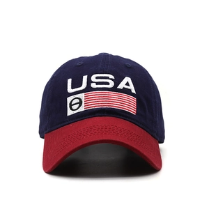 Close-up of USA embroidery and flag design on a navy blue and red baseball cap