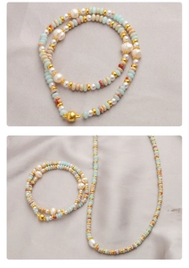 Detail of colorful stone and pearl beaded necklace set with golden magnetic clasp