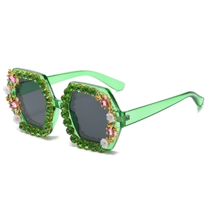 Green crystal square sunglasses with pink floral accents and stones in a 45-degree view