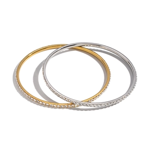 Minimalist geometric circle bracelets with inlaid diamonds in gold and silver set