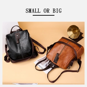 Detail of vintage PU leather backpacks in black and brown with textured pebble finish