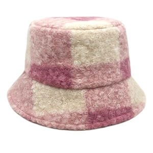 Close-up of pink and white checkered teddy fleece texture on a bucket hat