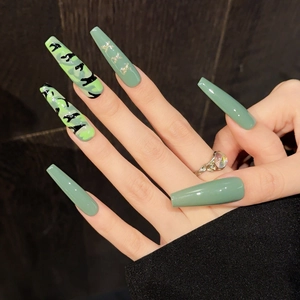 Sage green and camouflage coffin press-on nails with gold glitter star accents