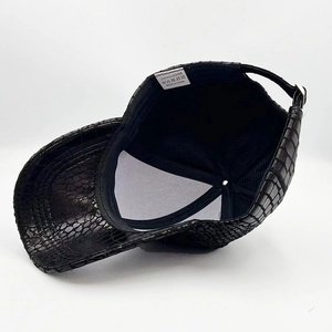 Close-up of black polyester lining and quality stitching on crocodile pattern baseball cap