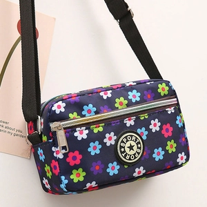 Floral print oxford crossbody bag in navy blue with adjustable strap and sport logo