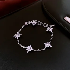 Elegant sparkling zircon snowflake bracelet with adjustable silver chain on black leather