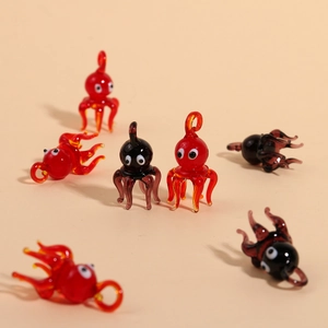 Artistic handmade glass octopus pendants in red and black for DIY jewelry crafts