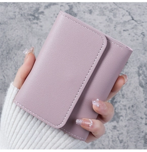 Detail of lavender PU leather wallet featuring lychee texture and white stitching details