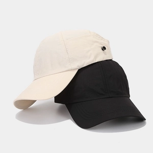 Detail of outdoor ponytail baseball cap showing metal circular accent and quick-dry fabric