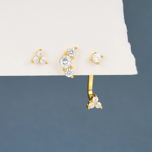 Detailed view of S925 silver gold-plated stud earrings set with zircon stones