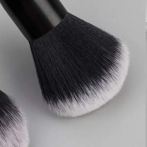 Detail of soft black and white gradient bristles on a professional makeup brush