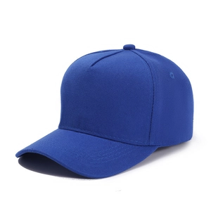 Detail view of navy blue five-panel baseball cap with twill cotton texture and curved brim