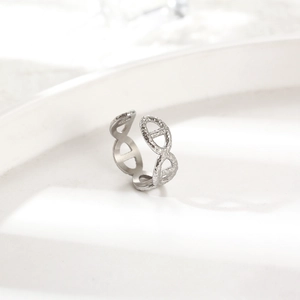 Silver chain link ring with hammered texture and polished finish on white tray