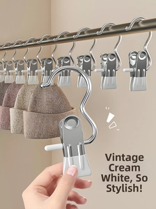 Close-up of cream-white coated stainless steel clips with S-hook for hanging laundry