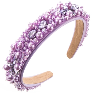 Detailed view of purple fabric headband with elegant faux pearls and sparkling glass rhinestones