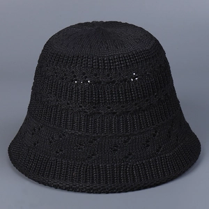 Detailed close-up of breathable hollow-out knitting texture on a black summer bucket hat