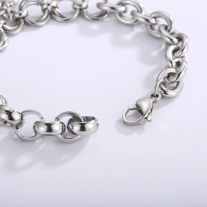 Macro shot of silver stainless steel chain bracelet with a secure lobster clasp