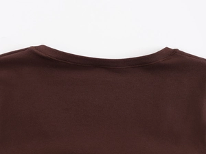 Detailed close-up showing the professional stitching and texture on a dark brown U-neck tee
