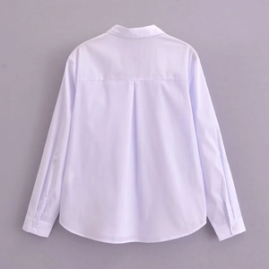 Women's deep V-neck white long sleeve shirt with pocket detail and curved hem design