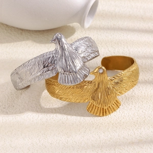 Minimalist 18K gold plated eagle cuff bracelet with intricate feather texture and zircon eye