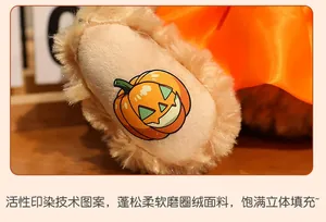 Detail of soft plush teddy bear foot with pumpkin print and premium boucle fabric