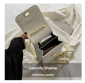 Capacity display of the white quilted crossbody bag holding a phone and card holder