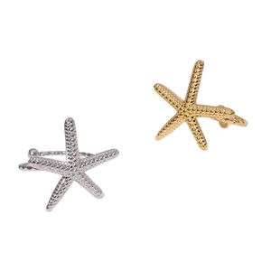 Minimalist starfish shaped stainless steel rings with textured gold and silver finishes