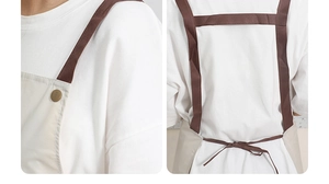 Detail of beige kitchen apron showing brown H-back straps, buttons and tie closure