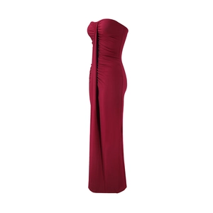Detail of red tube top dress with elegant ruched design and slim fit mermaid silhouette