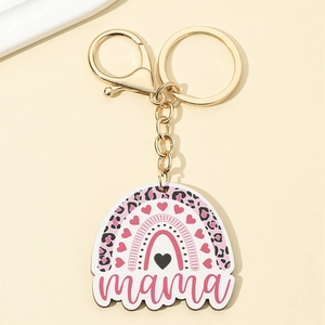Detail of leopard print mama keychain with golden hook and rainbow heart design