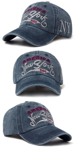 Detailed views of vintage washed blue baseball cap with multi-color 1985 embroidery