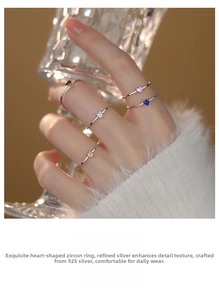 Detailed view of s925 silver rings with heart-shaped colorful cubic zirconia stones