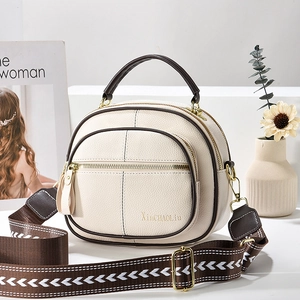 Minimalist creamy white multi-layer round crossbody bag with brown woven strap