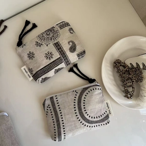 Mini canvas coin purse set with vintage patterns, zipper closure and tassel detail