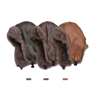 Winter faux leather trapper hat with warm fur lining and ear flaps in brown shades