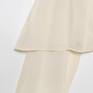Chic beige layered blouse with sheer chiffon hem and high-quality stitching details