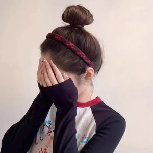 Classic red plaid fabric headband for women in a vintage preppy style worn by a model