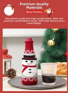 Close-up of knitted Christmas wine bottle cover with cute snowman pattern decoration