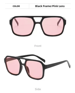 Close-up of double bridge retro sunglasses with black frame and pink translucent lenses