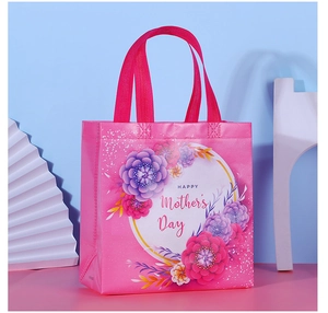 Pink Mother's Day non-woven gift bag with floral prints and HAPPY Mother's Day text