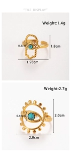 Detail of gold evil eye rings with hamsa hand and sun motif showing turquoise inlay