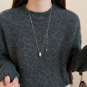 Minimalist silver waterdrop pendant necklace with high polish finish on a thin link chain