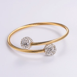 Adjustable golden twisted cable bangle with two crystal-studded beads for women