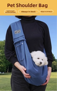 Navy blue breathable pet sling carrier featuring a small white dog in outdoor setting